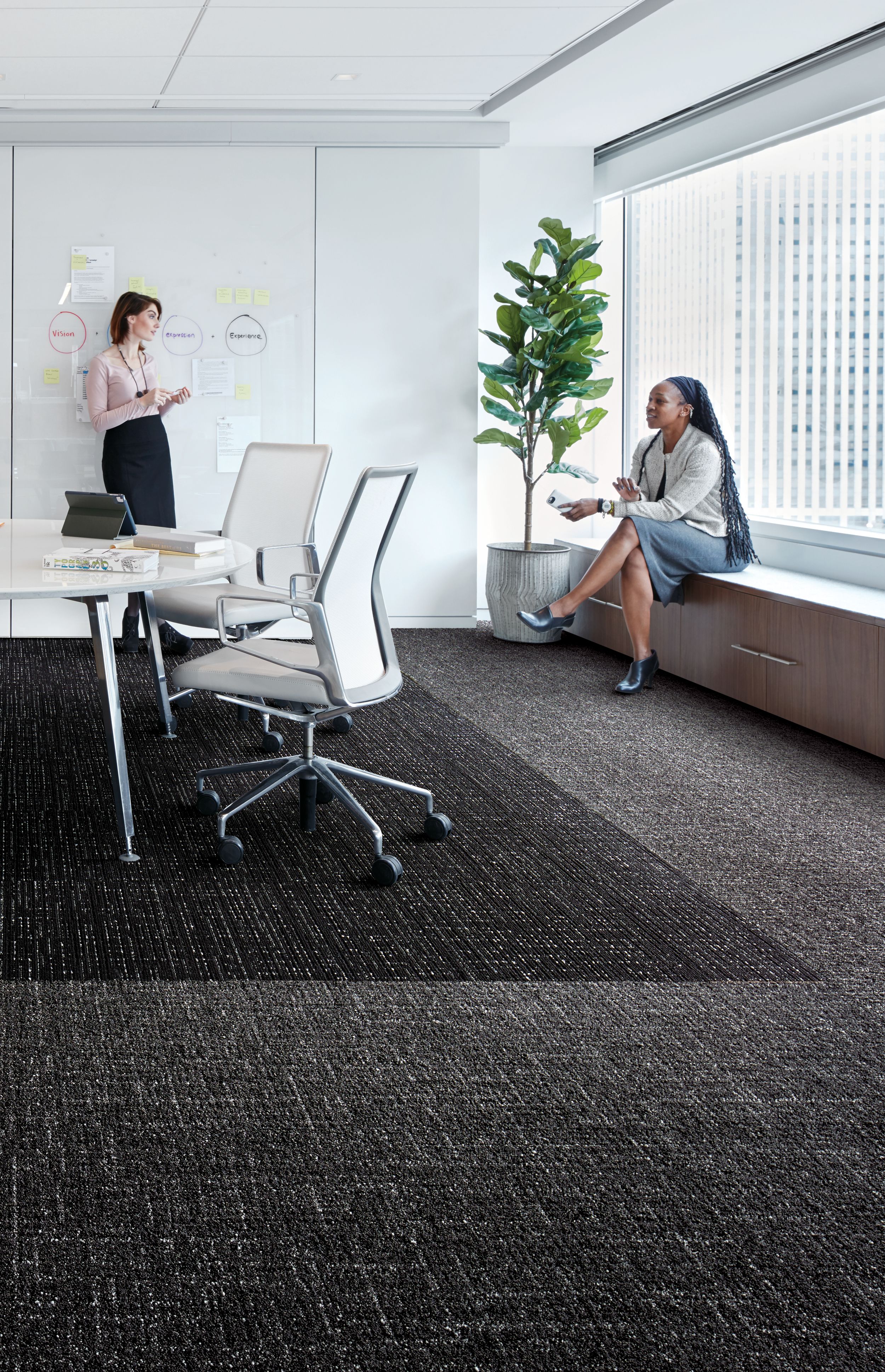 Interface Night Flight carpet tile and Haptic plank carpet tile in office working space with two women talking imagen número 6